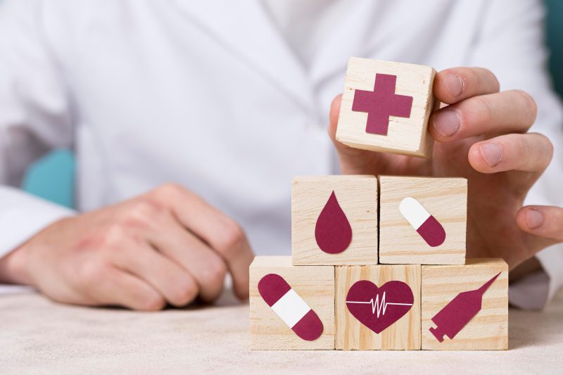 front-view-doctor-holding-medical-element 1